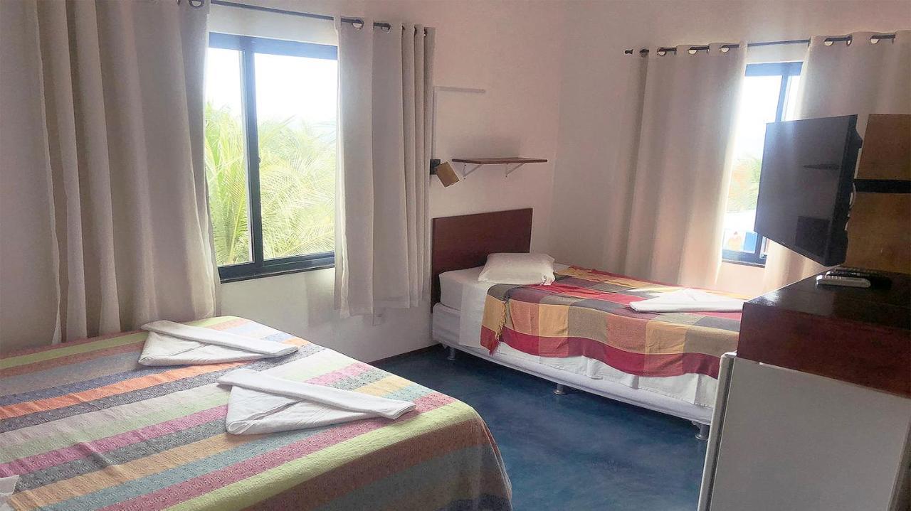 Quarto Quádruplo com Vista do Mar.