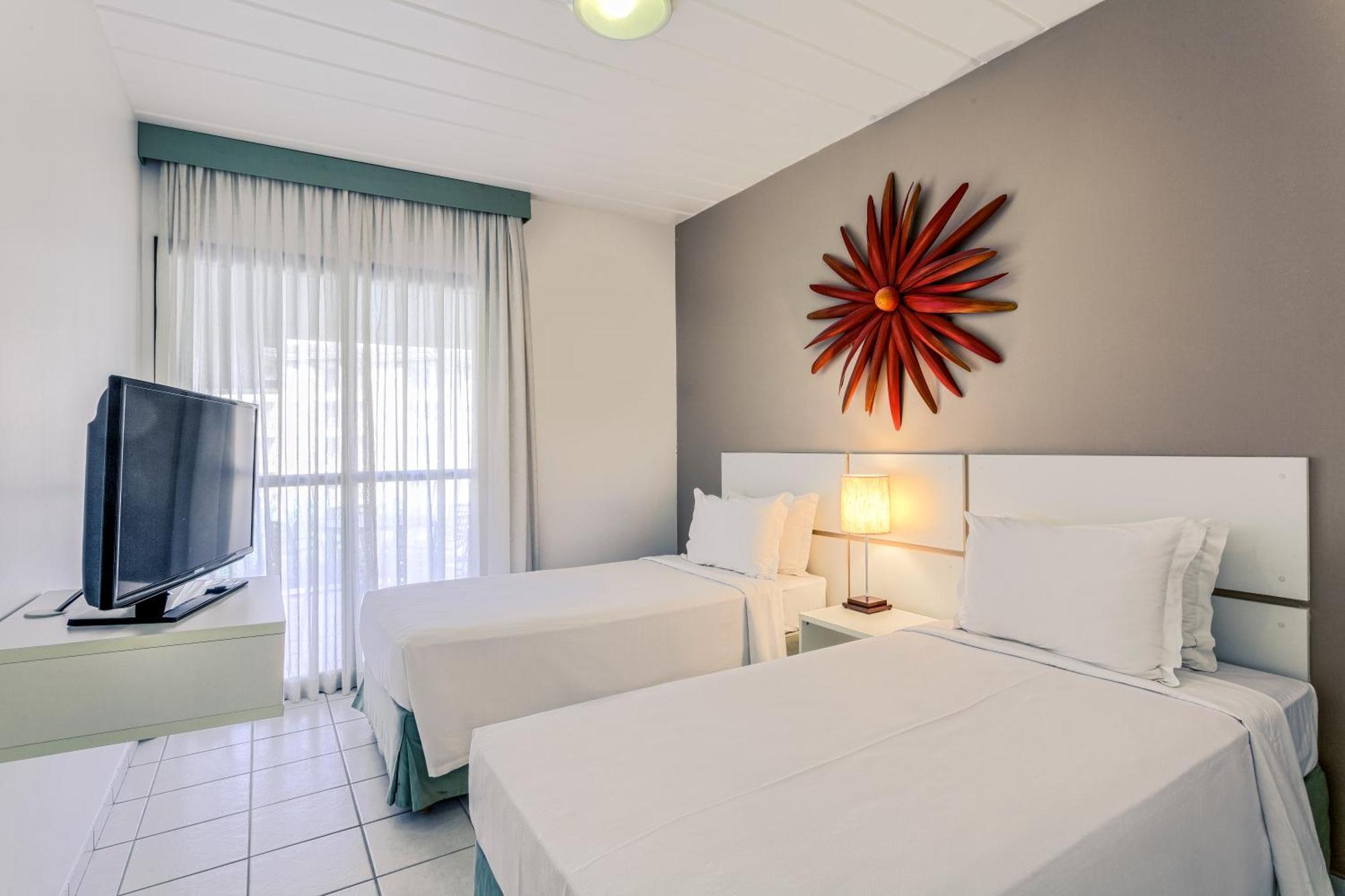 Suíte Superior com 2 Camas de Solteiro e Sofá-cama