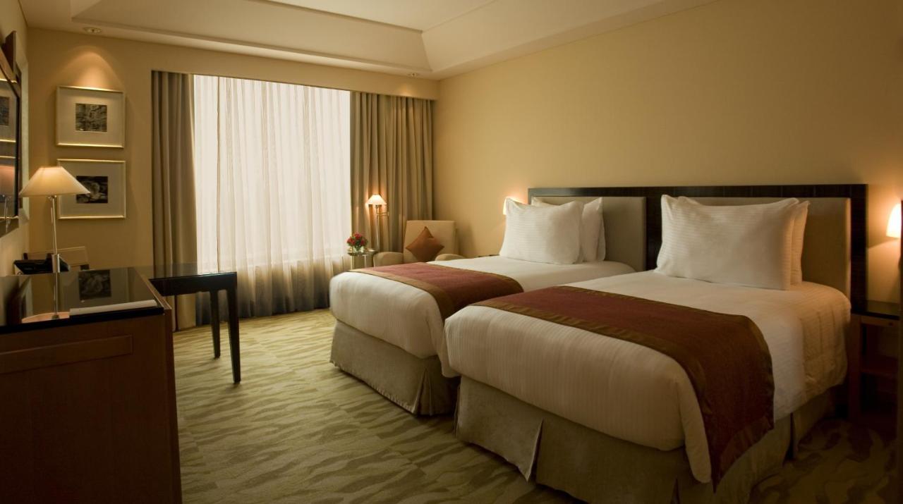 The Grand Deluxe Room with Twin Bed with 20% off on session of 30 mins Spa,15% off on food & soft beverage services,20% Discount on Laundry service,4 pints of beer (T&C applicable)