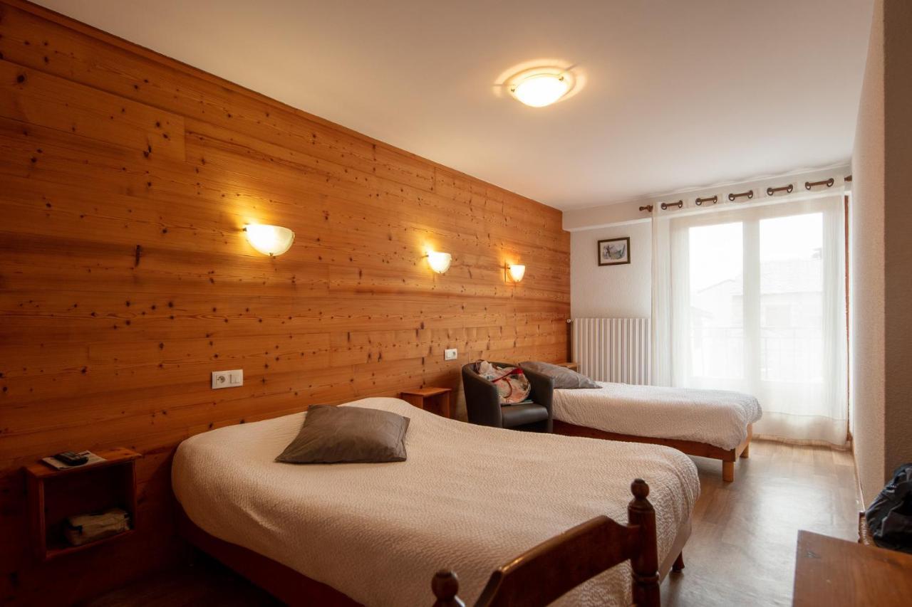Chambre Quadruple (1 Lit Double et 2 Lits Simples)