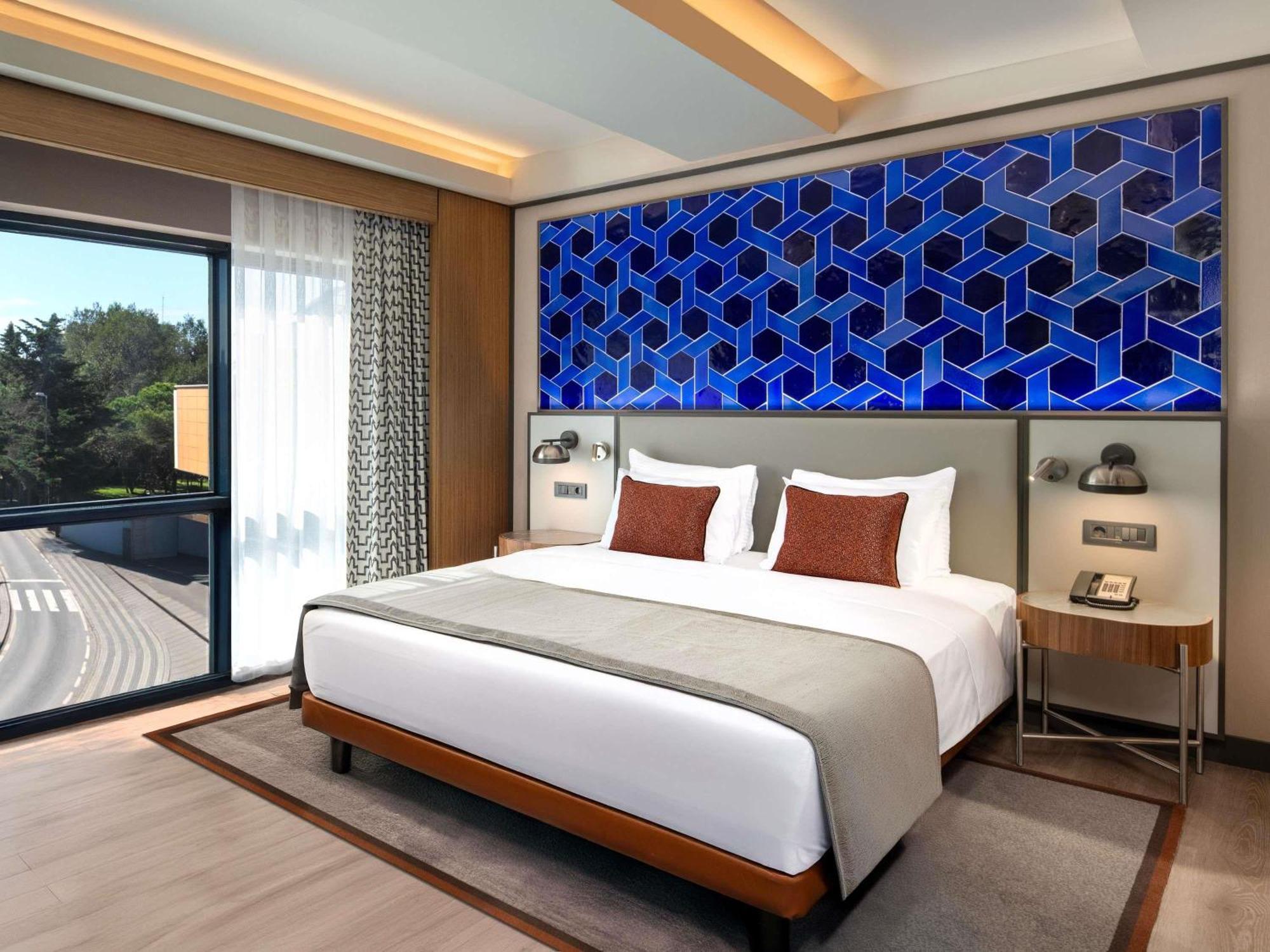 Junior Suite mit einem Doppelbett und Sofa