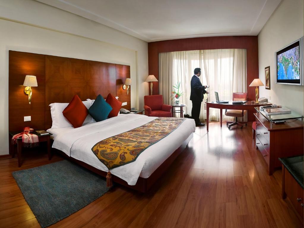 Lalit Club Room Twin Bed with Complimentary One way Airport Transfers , 15% off on session on Spa and Enjoy Happy Hours with 1+1 offer on Beverages
