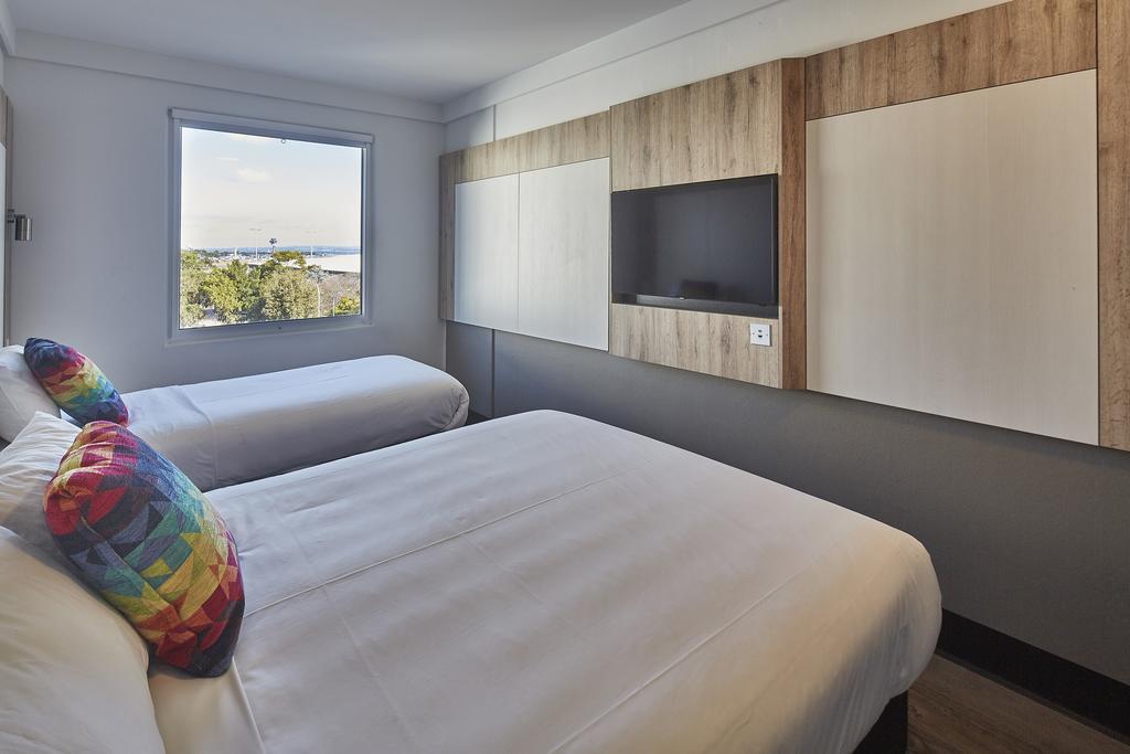 Habitación Triple Clásica - 1 cama grande y 1 cama individual