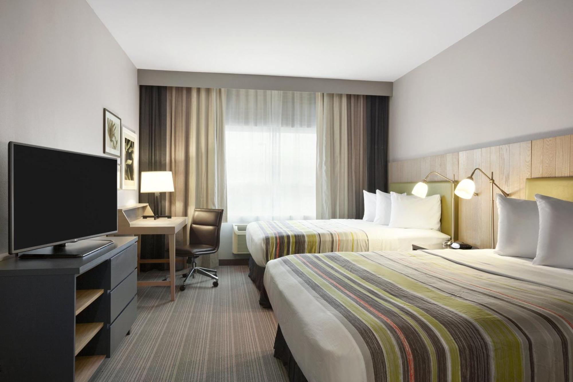 Queen Studio Suite with Two Queen Beds and Roll-In Shower