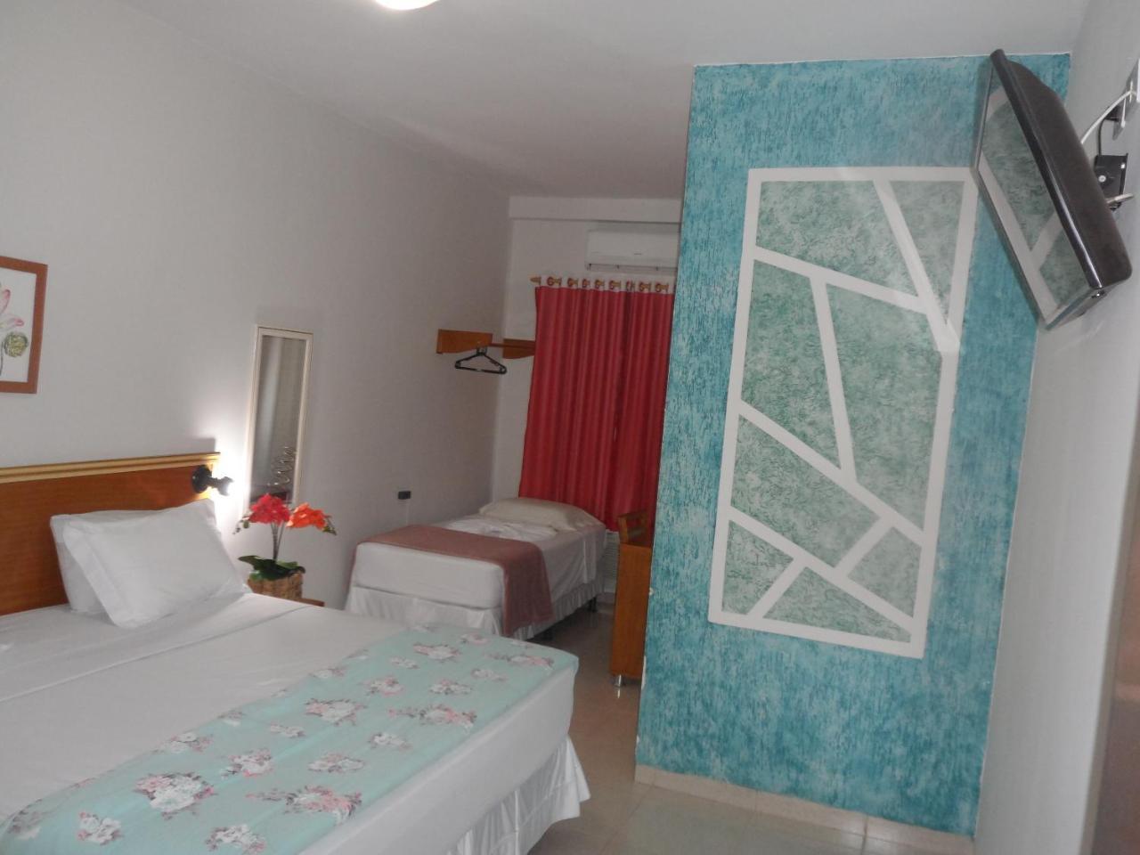 Quarto Triplo Executivo