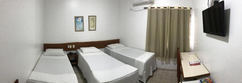 Quarto Triplo com 3 Camas de Solteiro